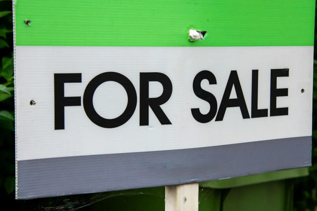 For sale sign in front of a home